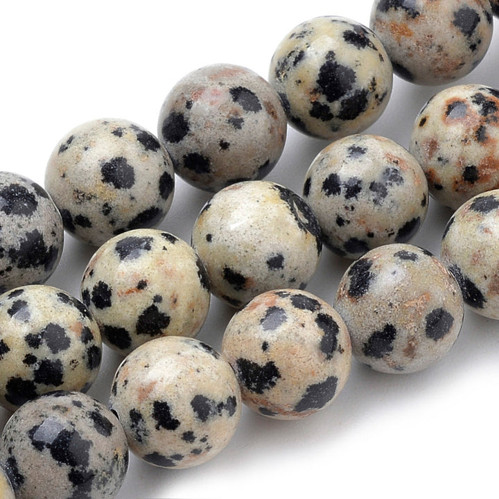 Natural Dalmatian Jasper Beads Strands, Round. Dalmatian Stone, also called Dalmatian Jasper, is a Pale Grey-Cream or Beige-Brown Jasper Stone with Brown and/ or Black Spots. Dalmatian Jasper Semi-precious Gemstone Beads for DIY Jewelry Making.  Size: 10mm Diameter, Hole: 1mm, approx. 37-39pcs/strand, 15" Inches Long.   Material: Genuine Dalmatian Jasper Semi Precious Stone Beads, Round, Cream Color with Black Spots. Polished, Shinny Finish.