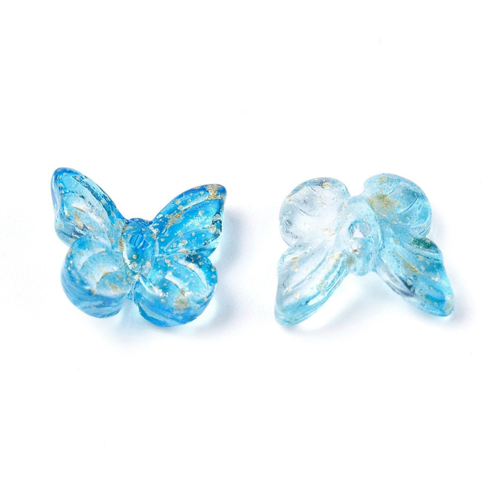 Indulge in the vibrant beauty of our Butterfly Glass Beads! Each bead is electroplated with a shimmering golden foil, adding a touch of elegance to the colorful mix. Measuring at 11mm by 10mm with a 1mm hole, these beads are perfect for creating eye-catching jewelry pieces. Discover endless design possibilities with this set of 25 beads.

Size: about 11mm wide, 10mm long, 4mm thick, hole: 1mm.

Material: Electroplated gold foiled glass beads. Random assortment of Mixed Colors.