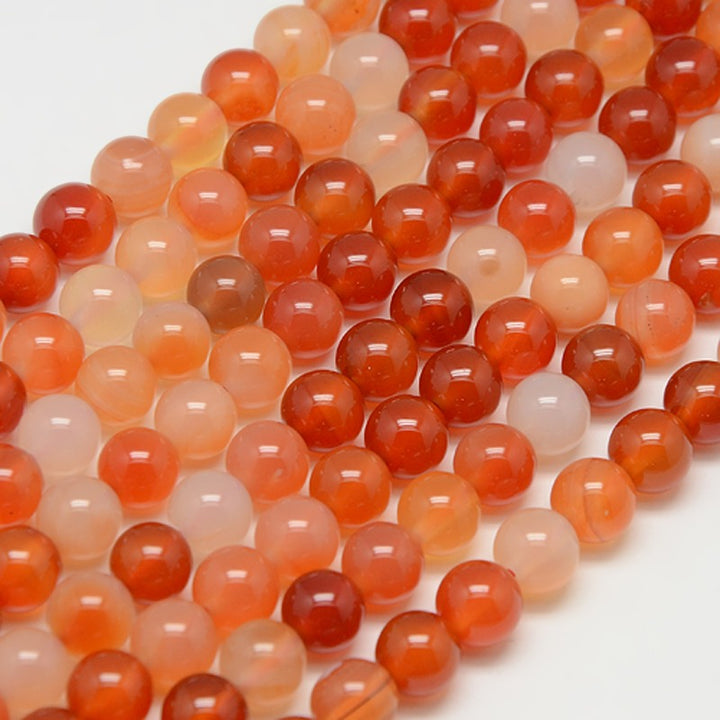 Natural Carnelian Stone Beads, Round, Orange Red Color. Semi-Precious Gemstone Beads for DIY Jewelry Making.   Size: 10mm Diameter, Hole: 1mm; approx. 38pcs/strand, 15" Inches Long.  Material: Natural Grade "A" Carnelian Stone Beads. Variance of Orange and Red Color. Polished Finish. 