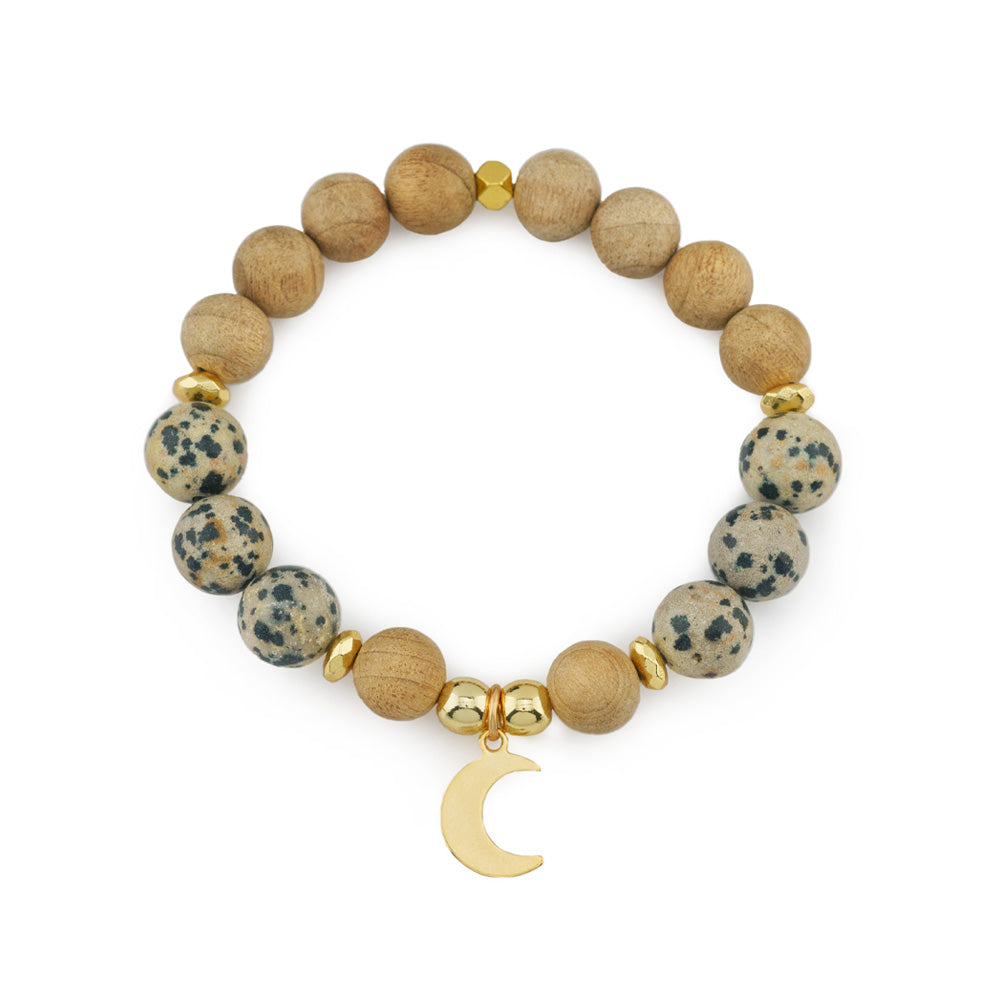 Chunky Beaded Gemstone Stretch Bracelet made of Dalmatian Jasper &amp; Burlywood Wooden Beads Accompanied with a Stainless Steel Gold Moon Charm.

Material: 10mm Dalmatian Jasper Beads and 10mm Burlywood Wooden Beads Strung on Stretchy Elastic Cord. Stainless Steel Gold Moon Charm. 6mm Gold Hematite Accent Beads.

Size: 7.5" Inches

Add a bold statement to your jewelry collection with this Chunky Beaded Gemstone Stretch Bracelet, featuring a unique blend of 10mm Dalmatian Jasper beads and Burlywood wooden 
