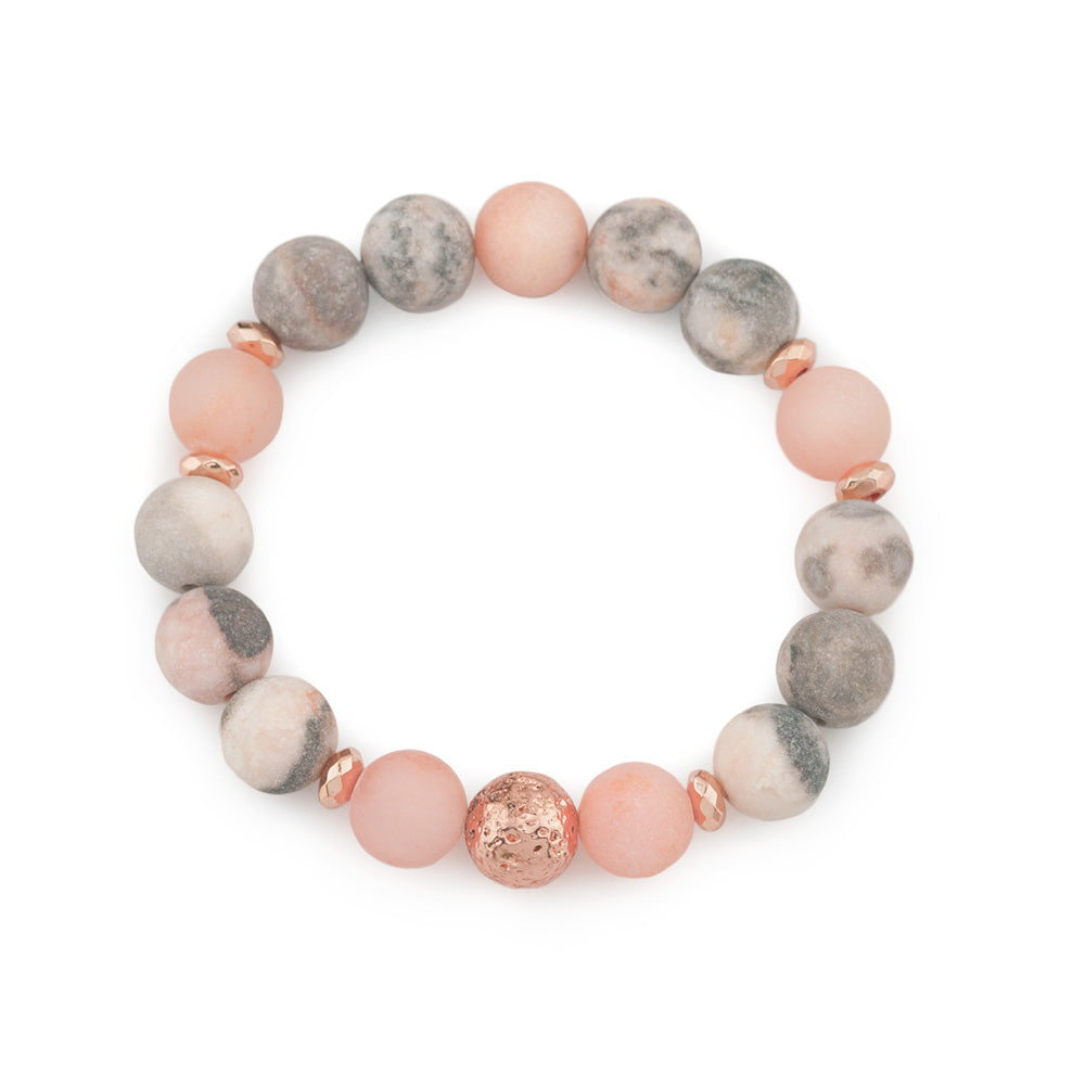 Trendy Matte Frosted Pink Zebra Jasper, Sunstone &amp; Rose Gold Lava Rock Beaded Gemstone Stretch Bracelet.

This bold and stylish Chunky Beaded Stretch Bracelet features a mix of 10mm matte frosted Pink Zebra Jasper, 10mm frosted Sunstone, and showcasing a 10mm electroplated rose gold Lava Rock bead as the focal point. The bracelet is accented with 6mm rose gold faceted rondelle hematite beads, with a 10mm rose gold hematite bead as the striking centerpiece, making it the perfect focal point