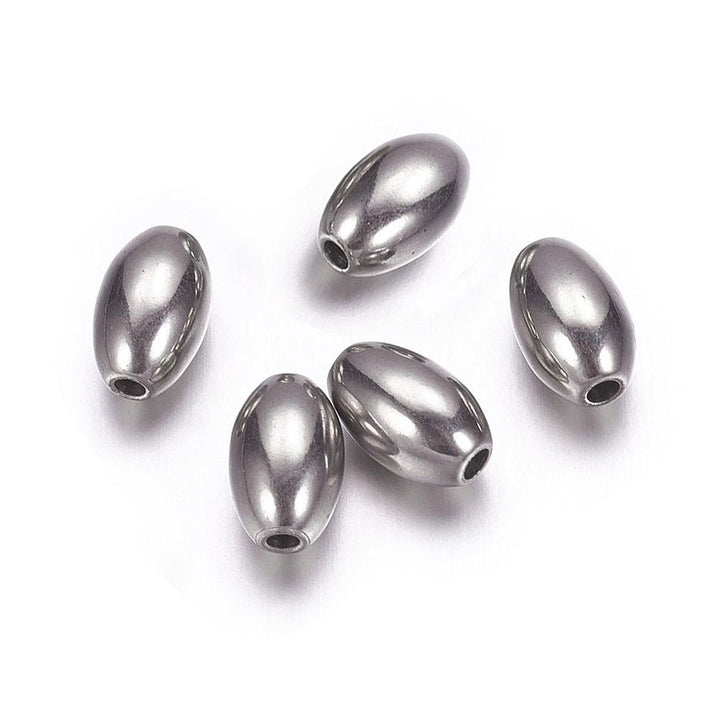 Stainless Steel Oval Spacer Beads, Stainless Steel Silver Color. Spacers for DIY Jewelry Making Projects. High Quality, Versatile, Non-Tarnish Spacers for Beading Projects.  Size: 6mm Diameter, 9mm Length, Hole: 1.3mm, approx. 10pcs/bag.   Material: 304 Stainless Steel Spacer Beads. Non-Tarnish, Stainless Steel Silver Color, Oval Shape, Polished, Shinny Finish.