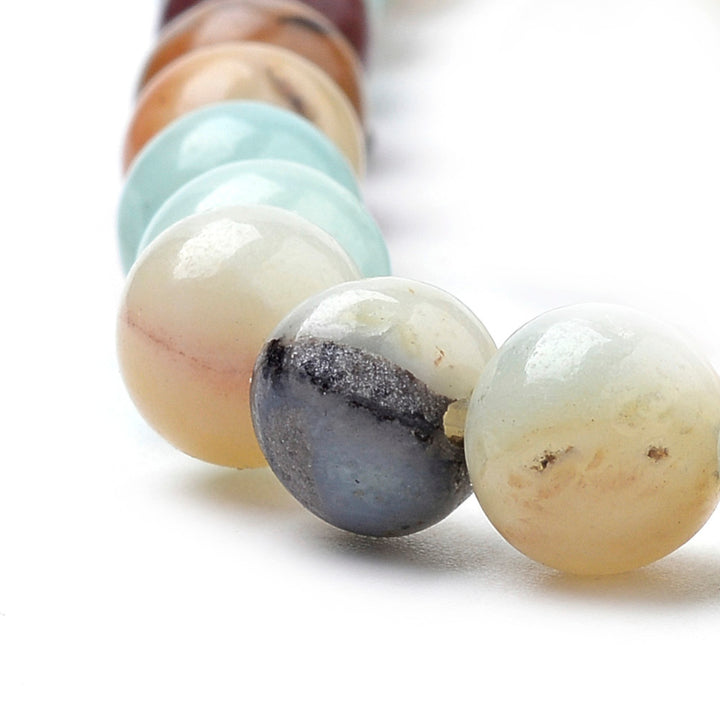 Natural Amazonite Beads, Round, Multi-Color. Semi-Precious Amazonite Beads for DIY Jewelry Making.   Size: 10mm Diameter, Hole: 1mm, approx. 38-40pcs/strand, 15" inches long.  Material: Genuine Natural Multi-Colored Amazonite, Loose Stone Beads, Multi-Color, Polished, Shinny Finish.   Amazonite Properties: Amazonite Beads are known as the Stone of Hope. It is Believed to have a Soothing Effect on the Nervous System. Amazonite is also Associated with Money, Luck and Overall Success. 