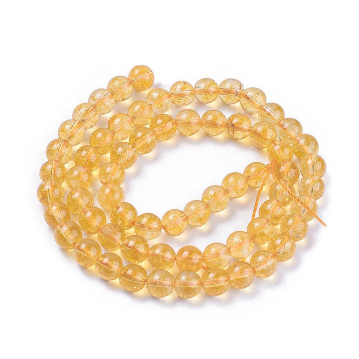 Citrine Beads, Round, Yellow Color. Semi-Precious Gemstone Beads for DIY Jewelry Making. Gorgeous, High Quality, Clear Deep Yellow Colored Citrine Beads.  Size: 6mm Diameter, Hole: 1mm; approx. 60pcs/strand, 15 inches long.  Material: Genuine Natural Citrine Beads, High Quality Stone Beads. Clear Deep Yellow Color, Polished, Shinny Finish. 