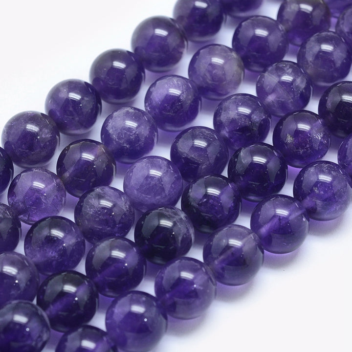 Natural Amethyst Beads, Round, Purple Color. Semi-Precious Gemstone Beads for DIY Jewelry Making. Gorgeous,   Size: 12mm Diameter, Hole: 1.2mm; approx. 32-33pcs/strand, 15" Inches Long.  Material: Genuine Natural Amethyst Beads, High Quality Beads. Dark Purple Color. Polished, Shinny Finish. 