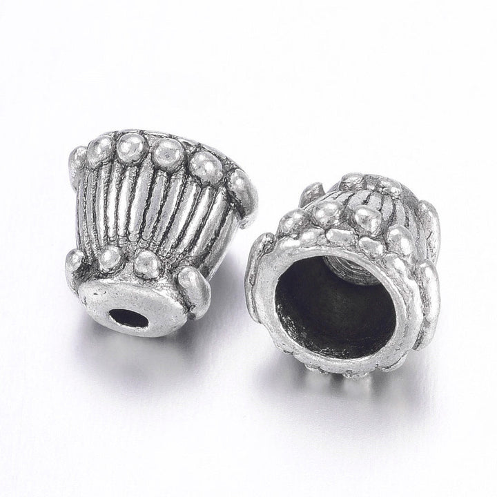 Alloy Bead Caps, Bead Cones Antique Silver Color for DIY Jewelry Making Projects.  Size: 9mm Width, 8mm Length, Hole: 2mm, approx. 9pcs/package.  Material: Tibetan Alloy Bead Caps, Cone Shape. Silver. Cadmium, Lead and Nickel Free.