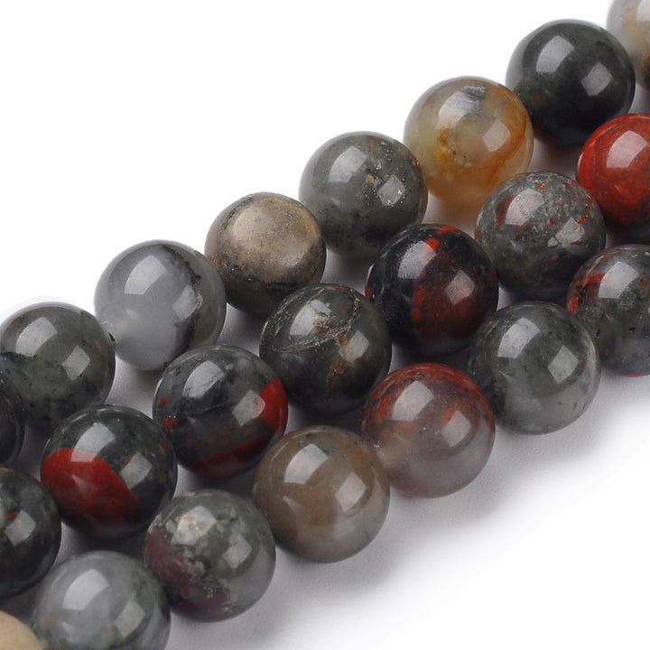 African Bloodstone Beads, Natural Heliotrope Semi-Precious Stone Beads.  Size: 6mm Diameter, Hole: 1mm; approx. 60-62pcs/strand, 15" Inches Long.  Material: Genuine Heliotrope Stone Beads; African Bloodstone Beads. Multi-color, Polished, Shinny Finish.