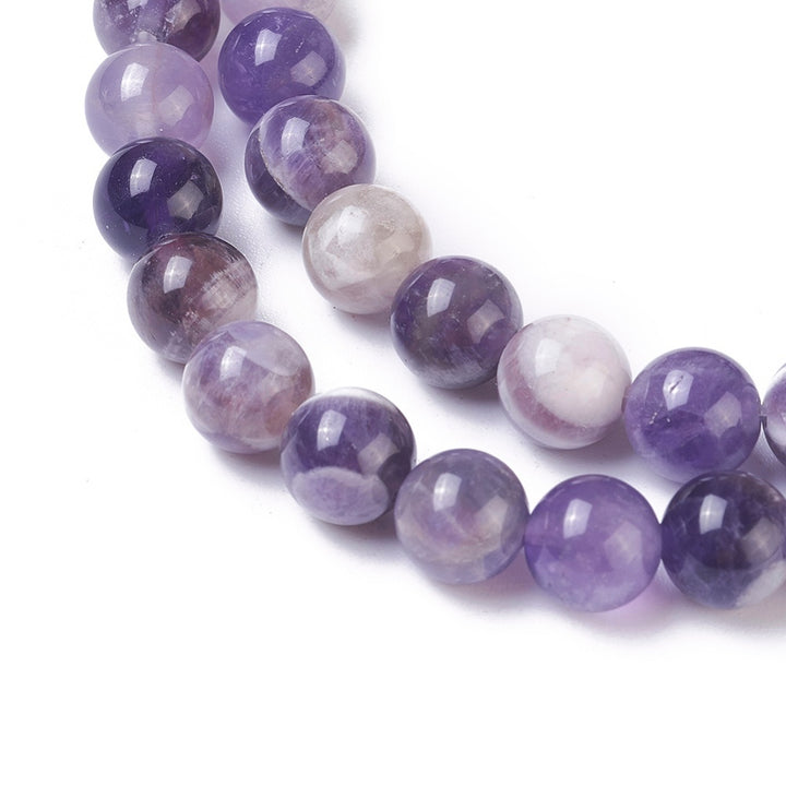 Natural Amethyst Crystal Beads, Round, Purple Color. Semi-Precious Gemstone Beads for DIY Jewelry Making. Gorgeous, High Quality Crystal Beads.  Size: 10mm Diameter, Hole: 1mm; approx. 40-41pcs/strand, 15" Inches Long.  Material: Genuine Natural Amethyst Crystal Beads. Purple with Clear Marking. Polished, Shinny Finish. 