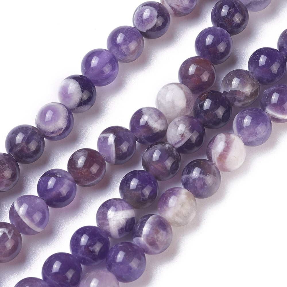 Natural Amethyst Crystal Beads, Round, Purple Color. Semi-Precious Gemstone Beads for DIY Jewelry Making. Gorgeous, High Quality Crystal Beads.  Size: 6mm Diameter, Hole: 1.2mm; approx. 64pcs/strand, 15" Inches Long.  Material: Genuine Natural Amethyst Beads, High Quality Crystal Beads. Purple with Clear Marking. Polished, Shinny Finish. 