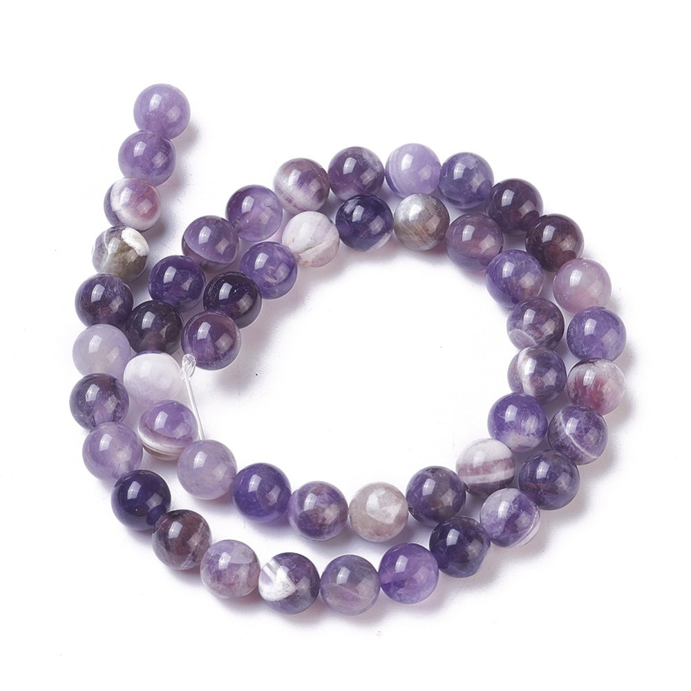 Natural Amethyst Crystal Beads, Round, Purple Color. Semi-Precious Gemstone Beads for DIY Jewelry Making. Gorgeous, High Quality Crystal Beads.  Size: 6mm Diameter, Hole: 1.2mm; approx. 64pcs/strand, 15" Inches Long.  Material: Genuine Natural Amethyst Beads, High Quality Crystal Beads. Purple with Clear Marking. Polished, Shinny Finish. 