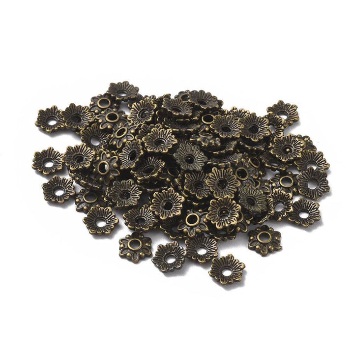 Multi Petal Alloy Flower Spacer Beads. Flower Shaped Bead Caps, Bronze Color. Flower Spacers for DIY Jewelry Making Projects.   Size: 8mm Diameter, 2mm Thick, Hole: 2mm, approx. 25pcs/package  Material: Alloy Flower Bead Caps. Antique Bronze Color. Lead, Cadmium and Nickel Free.