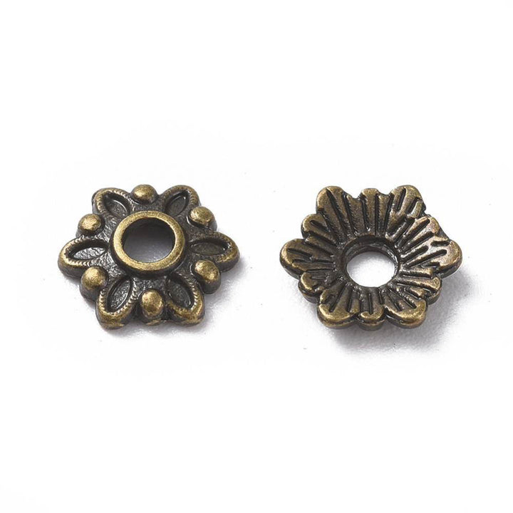 Multi Petal Alloy Flower Spacer Beads. Flower Shaped Bead Caps, Bronze Color. Flower Spacers for DIY Jewelry Making Projects.   Size: 8mm Diameter, 2mm Thick, Hole: 2mm, approx. 25pcs/package  Material: Alloy Flower Bead Caps. Antique Bronze Color. Lead, Cadmium and Nickel Free.