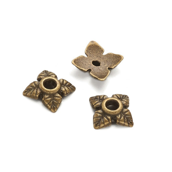 Alloy Flower Spacer Beads. Flower Shaped Bead Caps, Bonze Color. Flower Spacers for DIY Jewelry Making Projects.   Size: 6mm Diameter, 2mm Thick, Hole: 1mm, approx. 10pcs/package.  Material: Alloy Flower Bead Caps. Antique Bronze Color. Lead and Nickel Free.