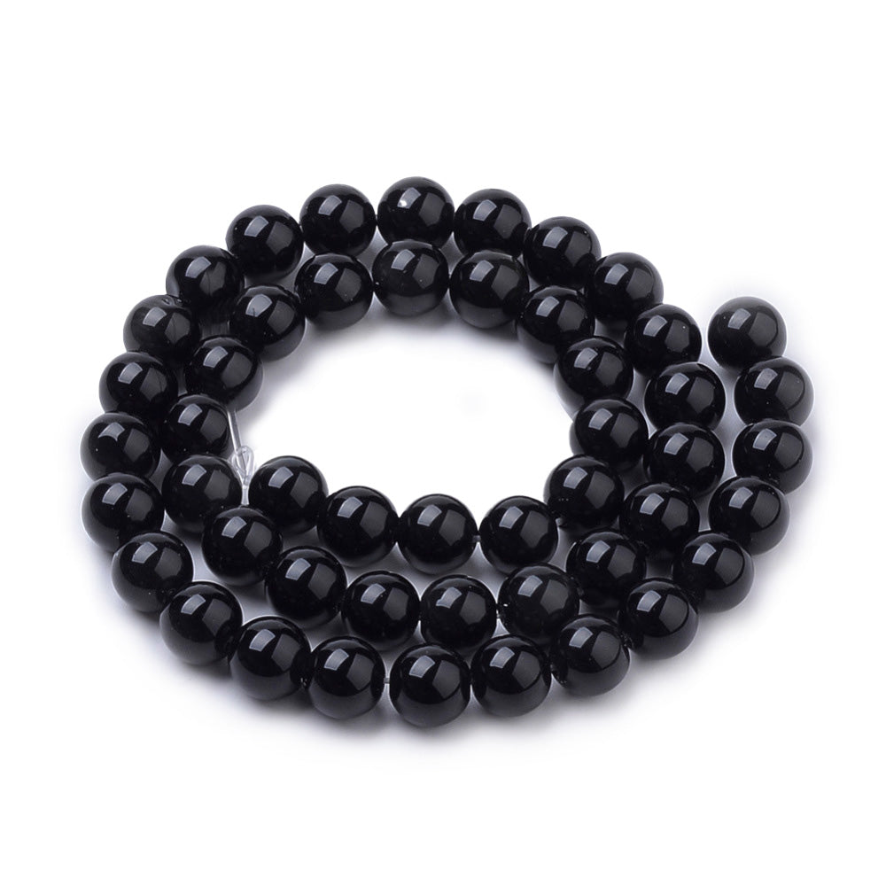 Black Onyx Beads, Black Color. Semi-Precious Gemstone Beads for DIY Jewelry Making.   Size: 12mm Diameter, Hole: 1mm; approx. 31-32pcs/strand, 15" Inches Long.  Material: High Quality Black Onyx, Dyed Black Color. Polished, Shinny Finish.