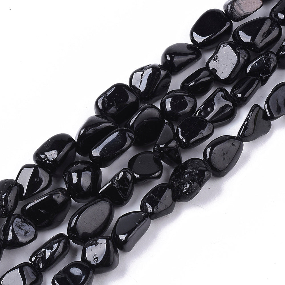 Natural Black Tourmaline Stone Beads, Round, Nuggets, Black Color. Semi-Precious Tourmaline Stone Beads for Jewelry Making. Great Addition to Necklace Designs. Size: approx. 5-11mm Long, 5-8mm Wide, 3-6mm Thick, Hole: 1mm; approx. 52-56pcs/strand, 15.5" Inches Long. bead lot, beads and more. www.beadlot.com