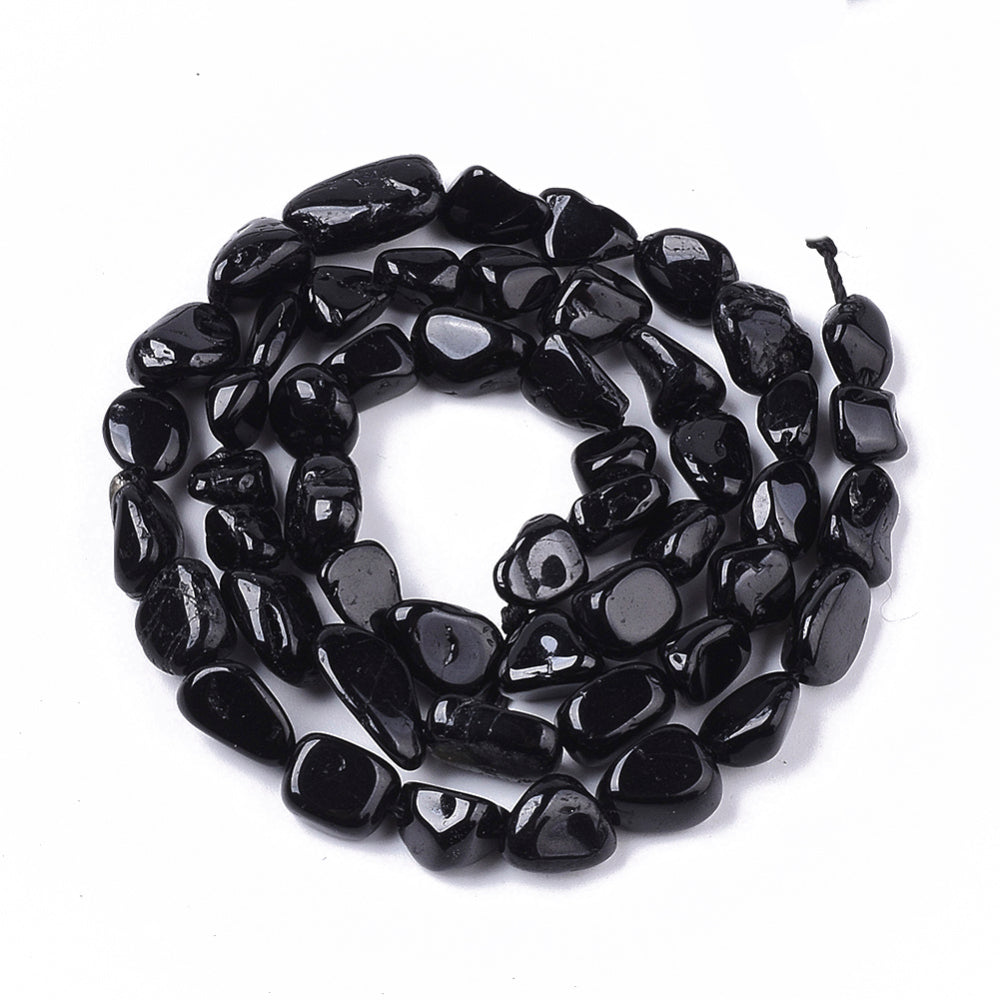 Natural Black Tourmaline Stone Beads, Round, Nuggets, Black Color. Semi-Precious Tourmaline Stone Beads for Jewelry Making. Great Addition to Necklace Designs.  Size: approx. 5-11mm Long, 5-8mm Wide, 3-6mm Thick,  Hole: 1mm; approx. 52-56pcs/strand, 15.5" Inches Long. bead lot, beads and more. www.beadlot.com