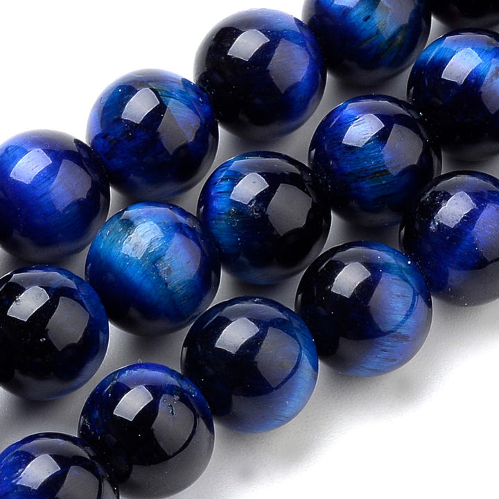 Natural Tiger Eye Beads, Blue Colored Semi Precious Stone Beads for DIY Jewelry Making. Gorgeous Royal Blue Tiger Eye Gemstone Beads.  Size: 8mm Diameter, Hole: 1mm; approx. 44 pcs/strand 14.9" inches long.  Material: Premium Grade Blue Tiger Eye Polished Loose Stone Beads, Beads. Dyed Dark Blue Polished, Shinny Finish. 