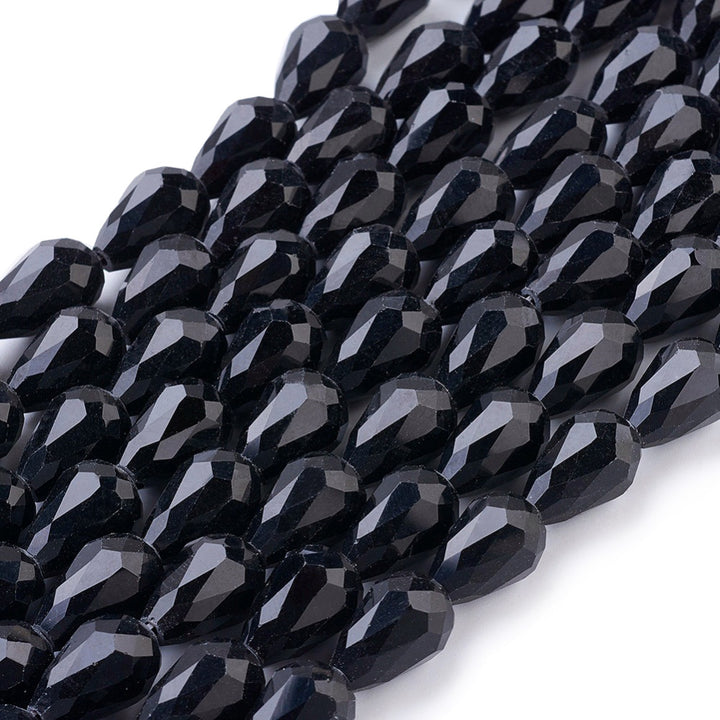 Teardrop Crystal Glass Beads, Faceted, Smoky Black Color, Glass Crystal Bead Strands. Shinny, Premium Quality Crystal Beads for Jewelry Making.  Size: 15mm Length, 10mm Thick, Hole: 1.5mm; approx. 48pcs/strand, 30" inches long.  Material: The Beads are Made from Glass. Glass Crystal Beads, Teardrop Shaped, Light Smoke Black Colored Beads. Polished, Shinny Finish.