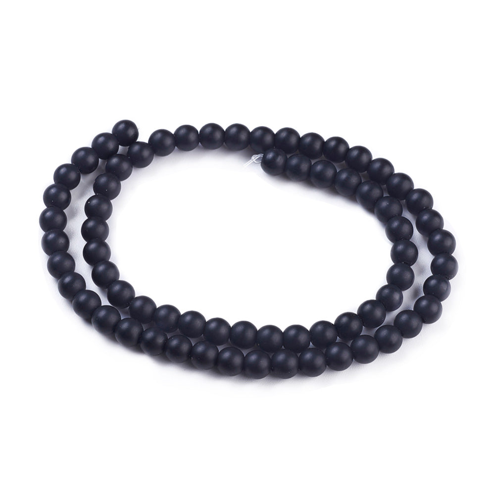 Frosted Black Stone Beads, Round, Matte Black Color. Affordable Stone beads.  Size: 6mm Diameter, Hole: 1mm; approx. 62pcs/strand, 15" Inches Long.  Material: Frosted Synthetic Black Stone Beads. Black Color. Unpolished, Matte Finish.   Wide Usage: Semi-Precious Black stone Beads are Excellent for Beading, Jewelry Making Supplies, Jewelry Design, DIY Gifts, Hand Crafts, Necklace and Bracelet Making. 