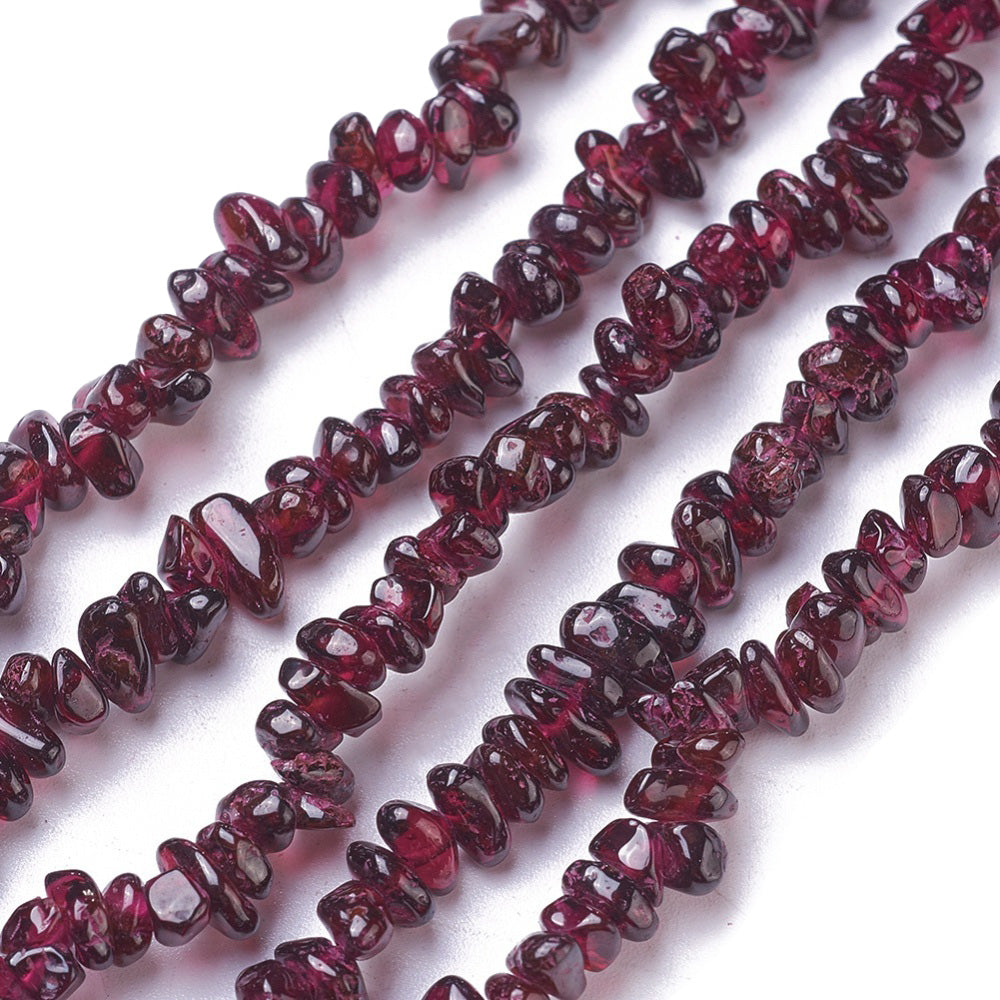 Genuine Garnet Chip Beads, Multi-color, Dark Red Color. Semi-Precious Stone Chips for Jewelry Making. Affordable High Quality Beads.  Size: approx. 4-8mm wide, 3-9mm long, Hole: 0.8mm; approx. 33.5 inches long.  Material: Premium Grade Natural Garnet Chip Bead Strands. Dark Red Garnet Chips. Polished, Shinny Finish.