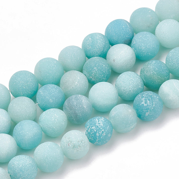 Beautiful Frosted Natural Amazonite Beads, Grade A, Matte Blue, Round Beads. Matte Semi-Precious Amazonite Gemstone Beads for DIY Jewelry Making.   Size: 6mm in diameter, hole: 1mm; about 61-63pcs/strand, 15" inches long.  Material: Grade "A" Genuine Amazonite Stone Beads, High Quality Stone Beads. Blue Color, Matte Finish.   Amazonite Properties: 