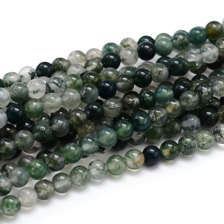 Moss Agate Beads, Round, Dark Green Color. Semi-Precious Gemstone Beads for Jewelry Making. Great for Stretch Bracelets and Necklaces.  Size: 6mm Diameter, Hole: 1mm; approx. 64pcs/strand, 15" Inches Long.  Material: Genuine Natural Moss Agate, Dark Emerald Green Color. Polished, Shinny Finish.