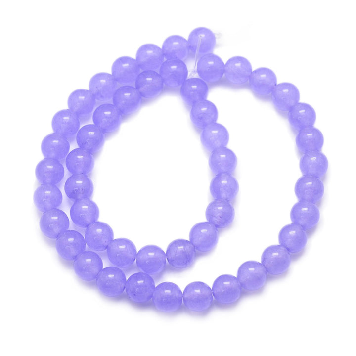 Natural Jade Bead Strand, Round, Lilac Color. Semi-Precious Crystal Gemstone Beads for Jewelry Making. Lilac Jade Beads are Affordable and Great for Stretch Bracelets.  Size: 6mm in diameter, hole: 0.8mm; approx. 62pcs/strand, 14.75" inches long.  Material: The Beads are Natural White Jade, Dyed a Lilac Color. Polished, Shinny Finish.