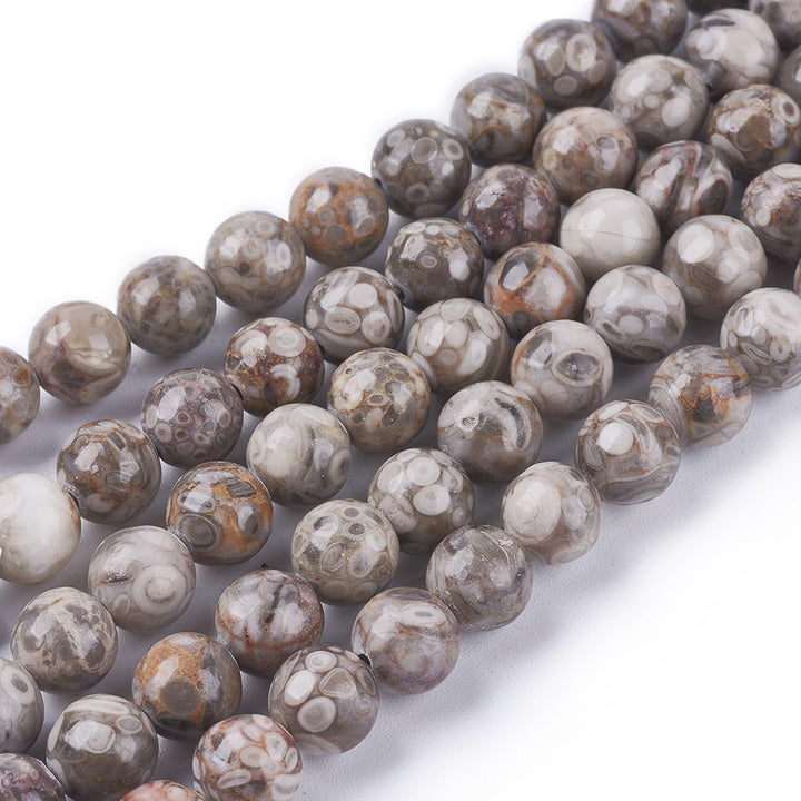 Natural Maifan Stone Beads, Round, Cream Color. Maifanite Semi-Precious Gemstone Beads for DIY Jewelry Making. Great for Mala Bracelets. Grey & Cream Color Fossil Beads.  Size: 4mm Diameter, Hole: 1mm; approx. 94pcs/strand, 15" Inches Long.  Material: Genuine Maifanite/Maifan Stone Beads. High Quality Natural Fossilized Medicine Stone Beads. Greyish Cream Color with Brown Markings. Polished Finish.