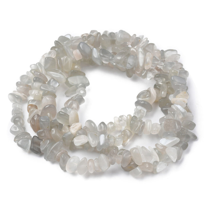 Natural Moonstone Chip Beads, White color, Pale White Grey Color. Semi-Precious Stone Chips for Jewelry Making.  Size: 5-8mm width, 5-8mm length, hole: 1mm; approx. 31.5 inches long.  Material: Genuine White Moonstone Chip Bead Strands. Clear White Moonstone Chips. Pale White/grey Colored Chip Beads. Polished, Shinny Finish.