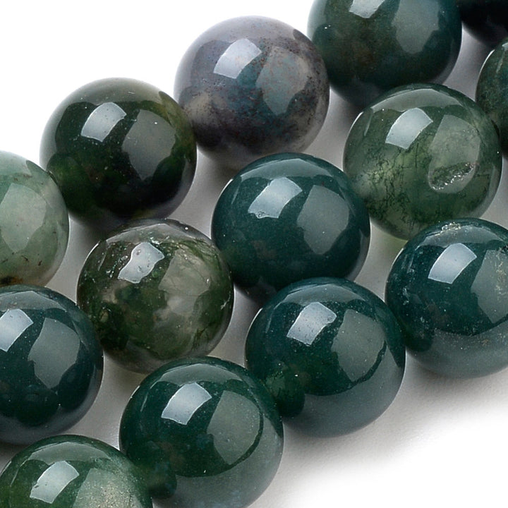 Premium Quality Natural Moss Agate Beads, Round, Dark Green Color. Semi-Precious Gemstone Beads for Jewelry Making. Great for Stretch Bracelets and Necklaces.  Size: 6mm Diameter, Hole: 1mm; approx. 62pcs/strand, 15" Inches Long.  Material: Natural Moss Agate, Dark Emerald Green Color. Polished, Shinny Finish.