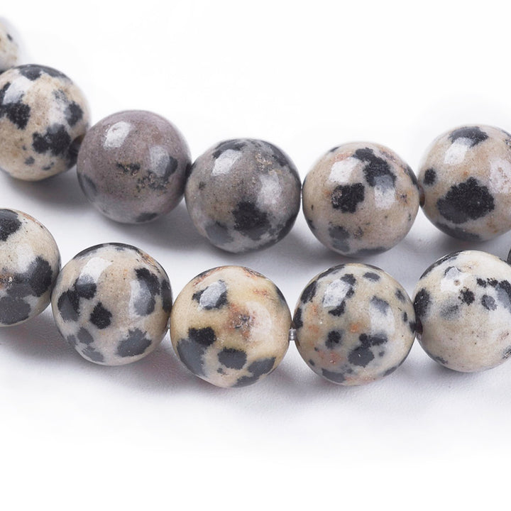 Natural Dalmatian Jasper Beads Strands, Round. Dalmatian Stone, also called Dalmatian Jasper, is a Pale Grey-Cream or Beige-Brown Jasper Stone with Brown and/ or Black Spots. Dalmatian Jasper Semi-precious Gemstone Beads for DIY Jewelry Making.