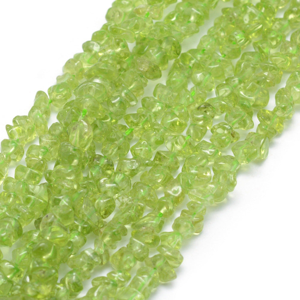 Peridot Chip Beads, Chips, Green Color. Semi-precious Peridot Beads.   Size: 3-5mm chips, Hole: 0.6mm; approx. 31.5 inches long.  Material: Genuine Natural Peridot Chips. Green Color Chip Beads. Polished, Shinny Finish.