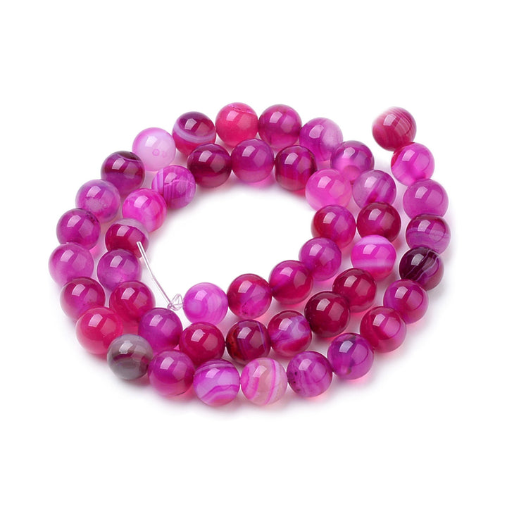 Fuchsia Striped Agate Beads, Round, Dyed, Pink Banded Agate. Semi-Precious Gemstone Beads for Jewelry Making. Great for Stretch Bracelets and Necklaces.  Size: 6mm Diameter, Hole: 1mm; approx. 62pcs/strand, 14.5" Inches Long.  Material: Striped Banded Agate Loose Beads Dyed Hot Pink Color. Polished, Shinny Finish.