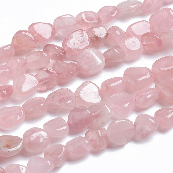 Rose Quartz Gemstone Beads, Oval, Tumbled Stone, Nuggets, Pale Pink Color. Semi-Precious Pink Quartz Beads for Jewelry Making.   Size: 5-11x4-9x4-10mm, Hole: 0.8mm; approx. 42-45pcs, 15.5" Inches Long.   Material: Natural Rose Quartz Tumbled Stone, Nugget Beads. Polished Finish.   