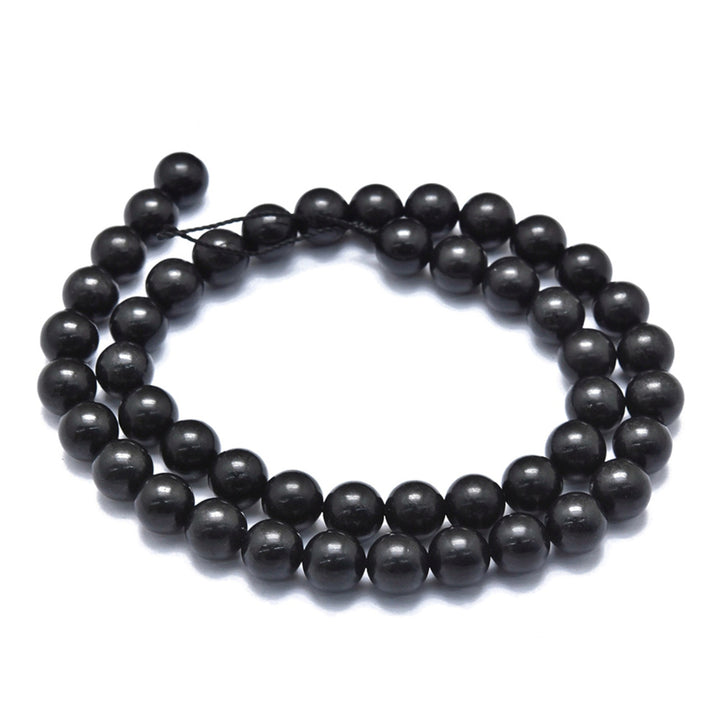 Natural Shungite Beads, Black Color. Semi-Precious Gemstone Beads for DIY Jewelry Making.   Size: 6-6.5mm Diameter, Hole: 0.6mm; approx. 60 pcs/strand, 15" Inches Long.  Material: Genuine Shungite Beads. Black Color. Polished, Shinny Finish.