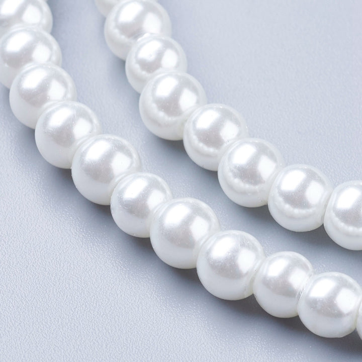 Glass Pearl Bead Strands, Round, White Color. Shinny Pearl Beads for Jewelry Making. Size: 8mm in diameter, hole: 1mm; approx. 105pcs/strand, 32 inches long.  Material: The Beads are Made from Glass. Glass, Pearlized, Round, White Color Beads. Polished, Shinny Finish.